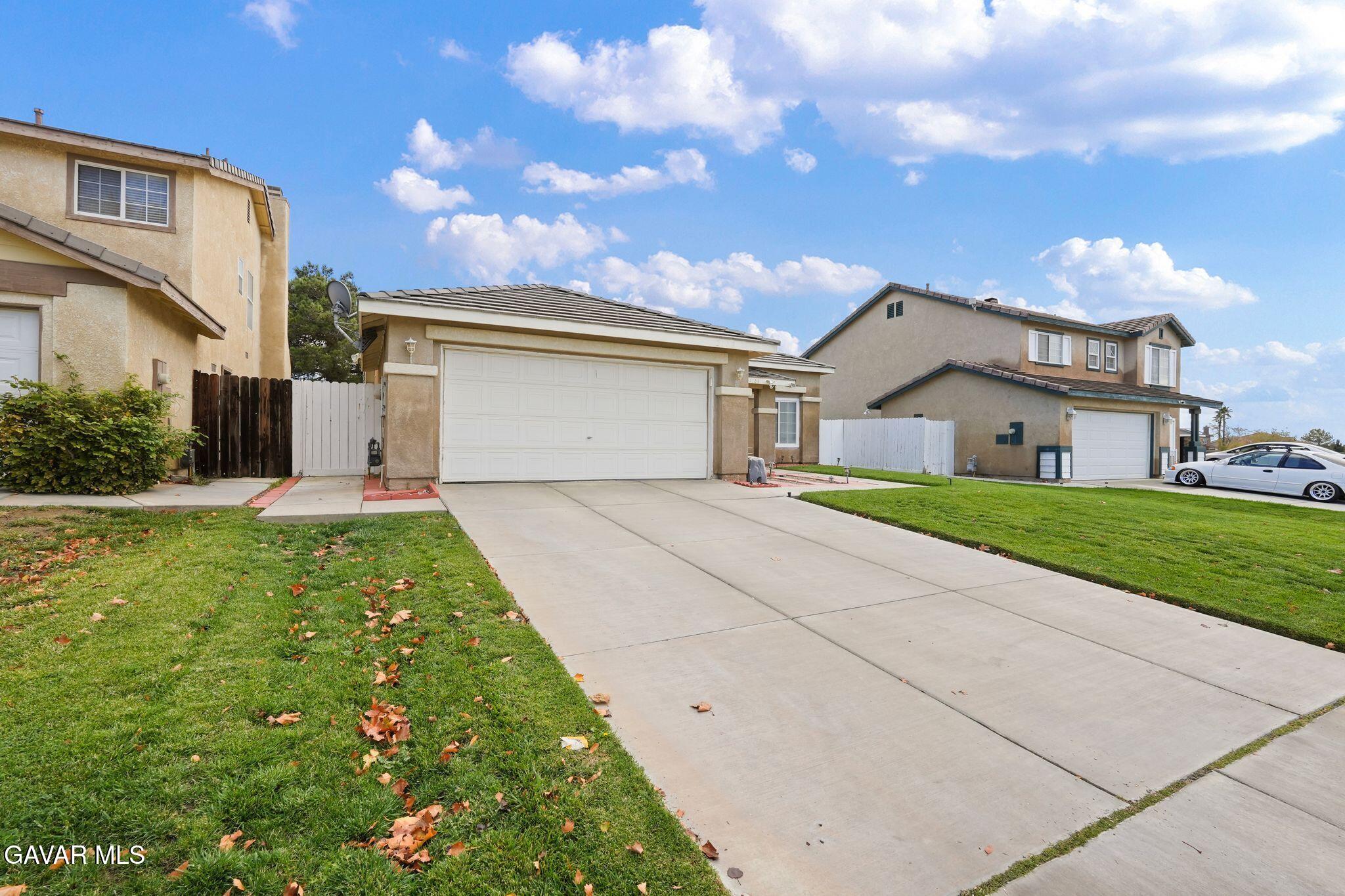 2108 Manchester Street Rosamond, CA 93560 - Photo 8 of 41 a view of house and garden
