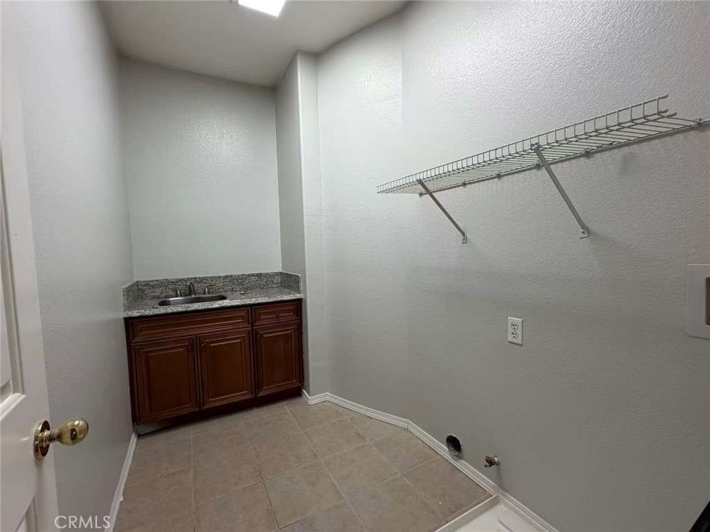 7162 Breno Place Rancho Cucamonga, CA 91701 - Photo 14 of 20 a room with storage and utility