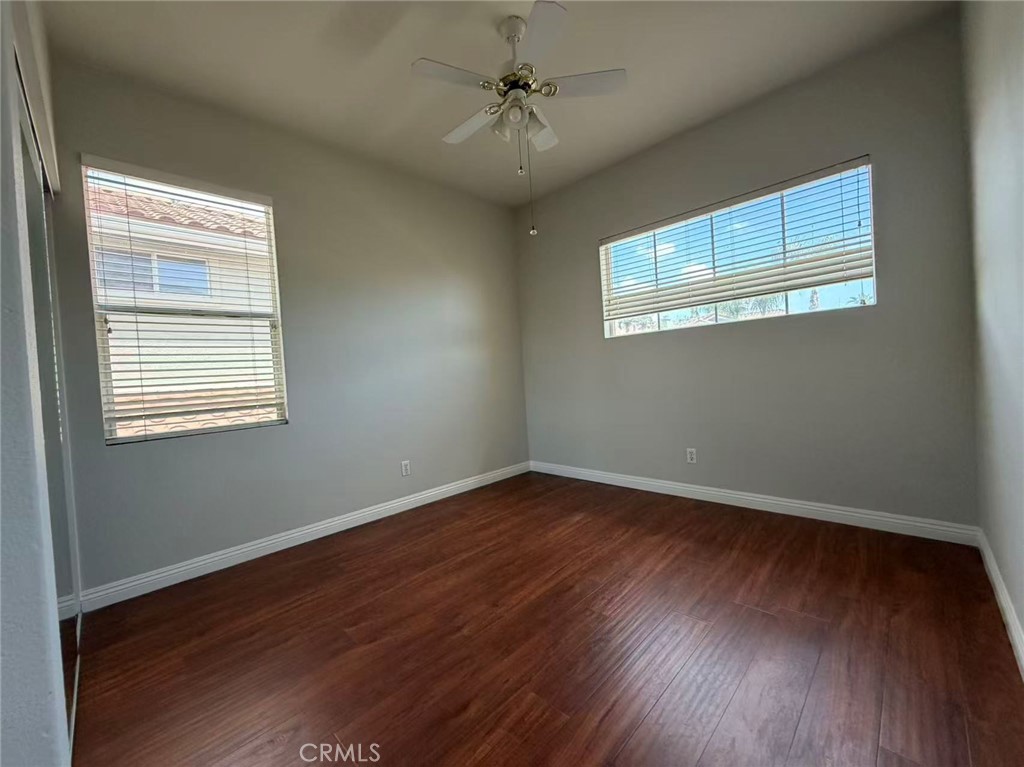 7162 Breno Place Rancho Cucamonga, CA 91701 - Photo 17 of 20 a view of an empty room with wooden floor and a window