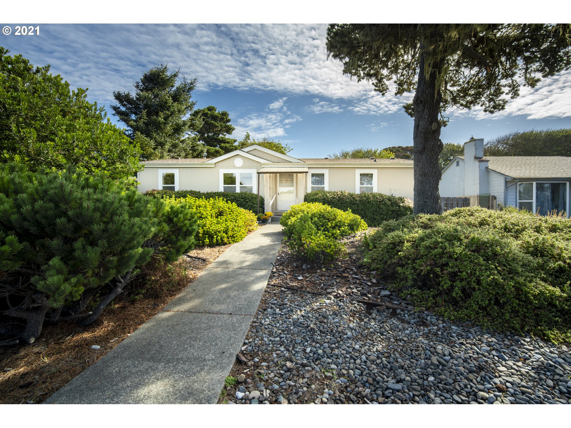 a front view of a house with garden
