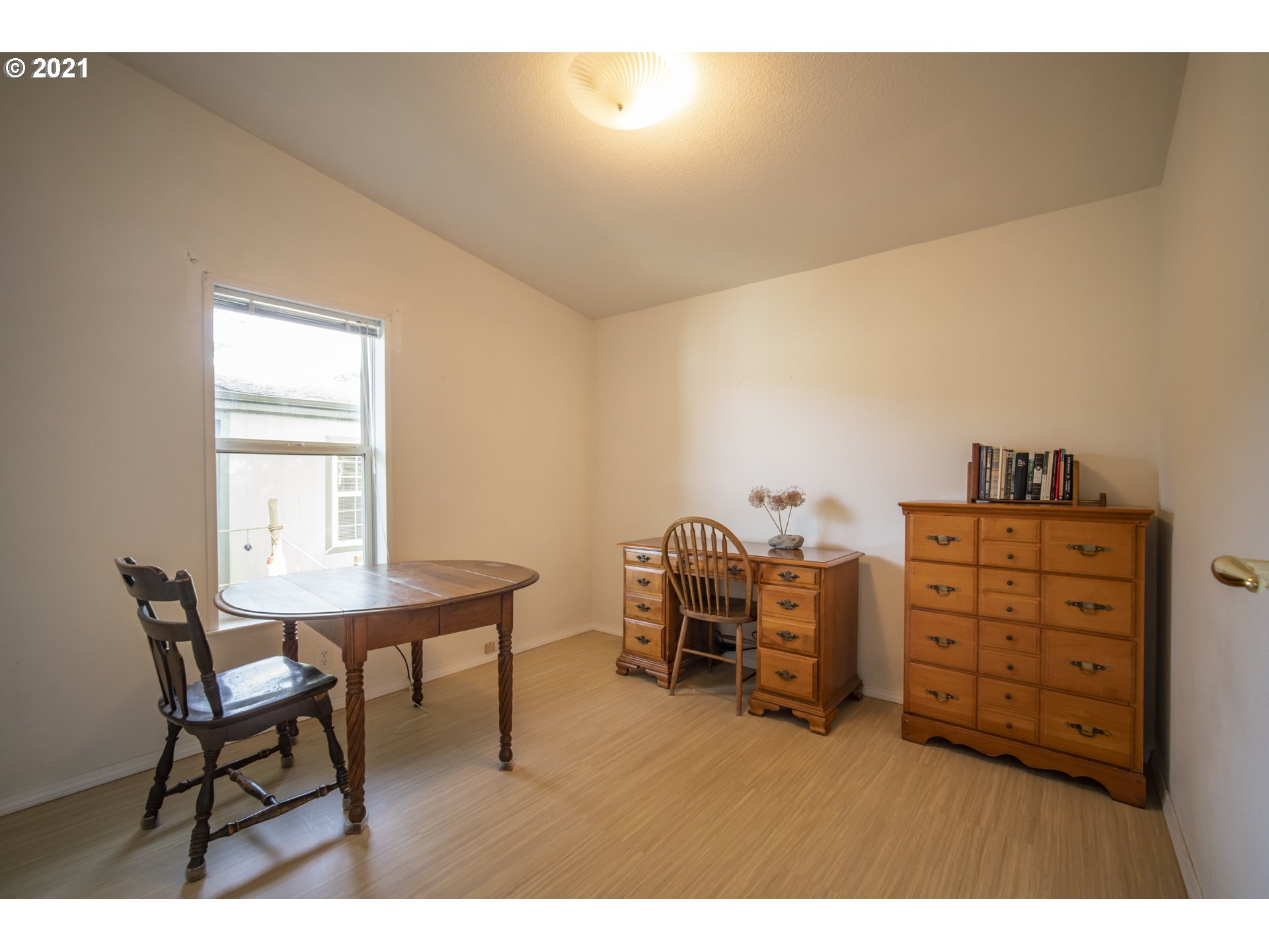 887 Jackson Avenue Southwest Bandon, OR 97411 - Photo 15 of 20 a bedroom with furniture and a closet