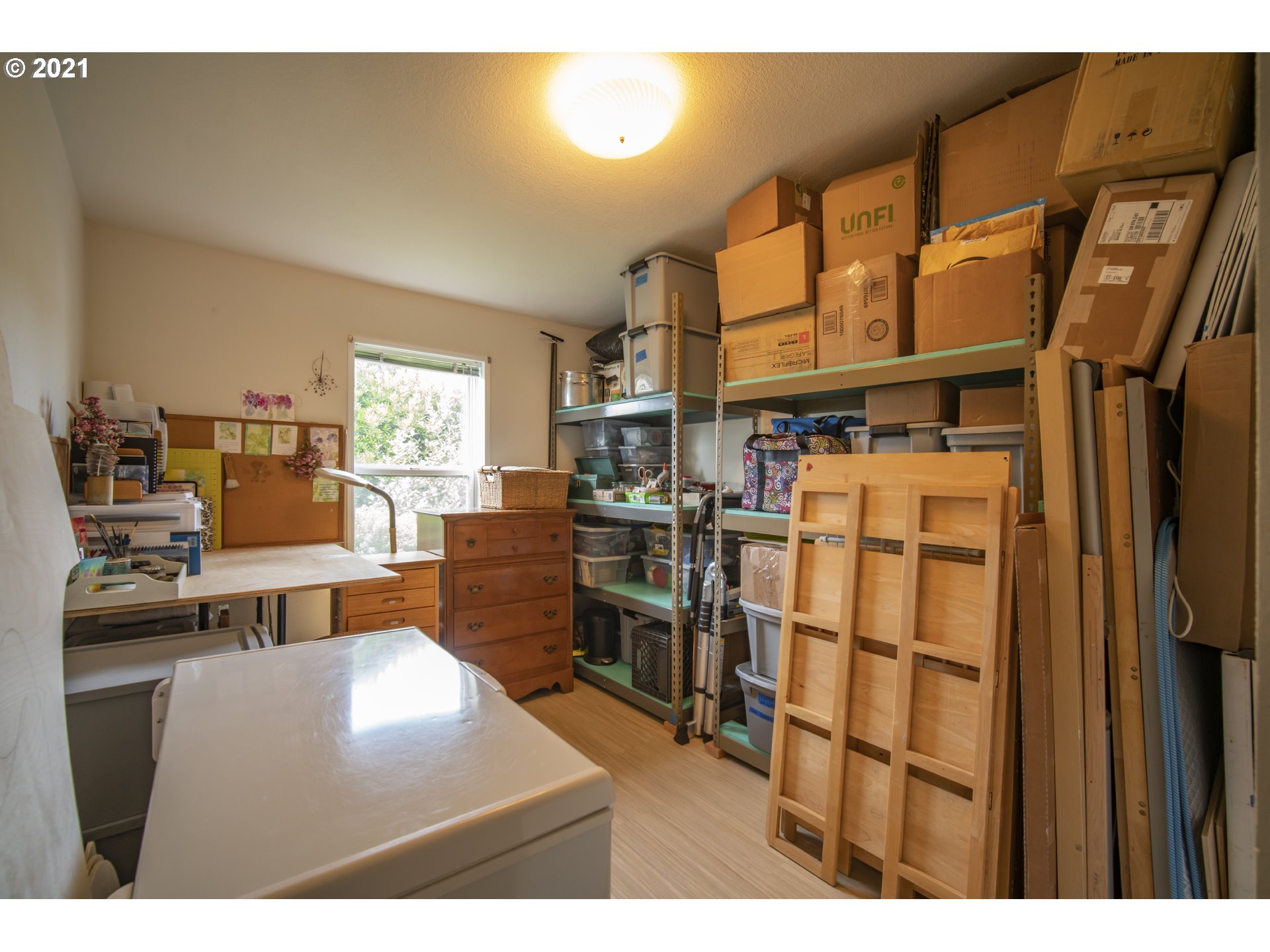 887 Jackson Avenue Southwest Bandon, OR 97411 - Photo 17 of 20 a living room with a couch and a dining table