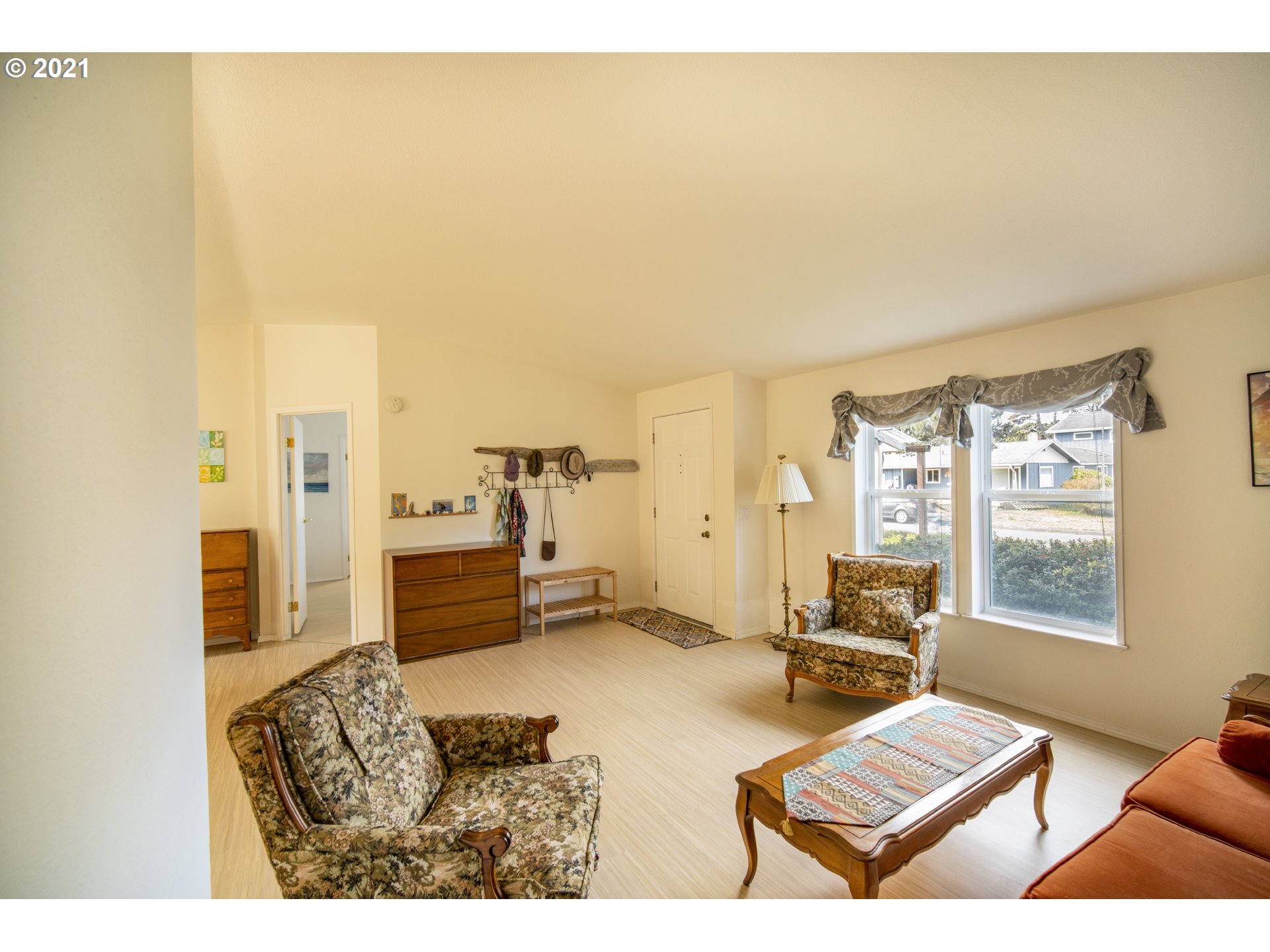 887 Jackson Avenue Southwest Bandon, OR 97411 - Photo 5 of 20 a living room with furniture and a table