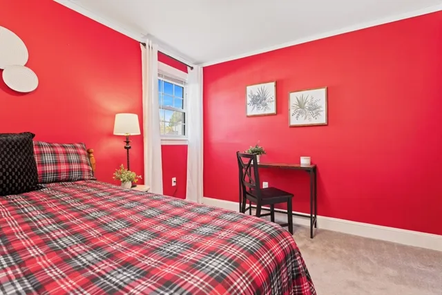 a bedroom with a bed and a chair