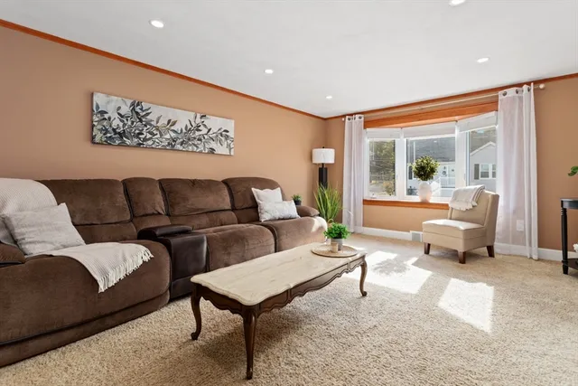 a living room with furniture and a rug