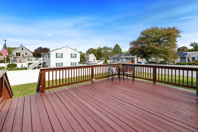 a view of balcony with wooden floor