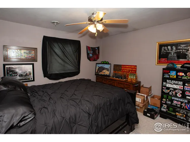 a bedroom with a bed and a television in it