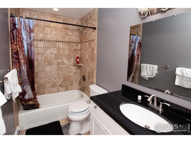 a bathroom with a sink a toilet and a bathtub