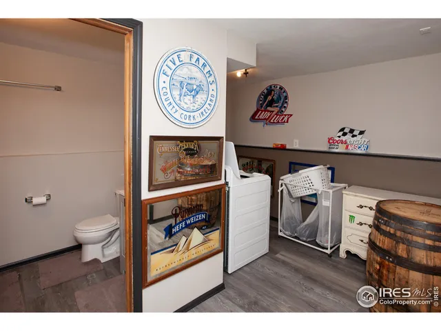 a view of a storage and utility room with washer and dryer