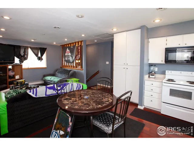 a kitchen with stainless steel appliances kitchen island granite countertop a sink and cabinets