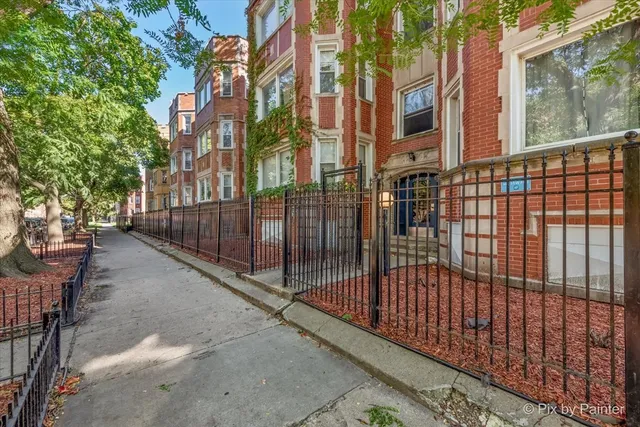 a view of a building with a backyard