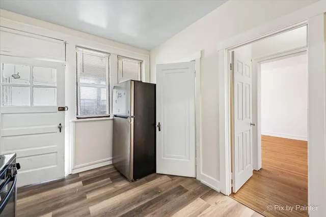 a spacious bathroom with a bathtub and toilet