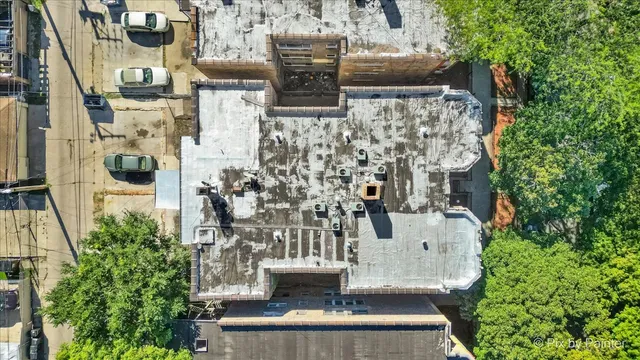 a view of kitchen with wooden floor and electronic appliances