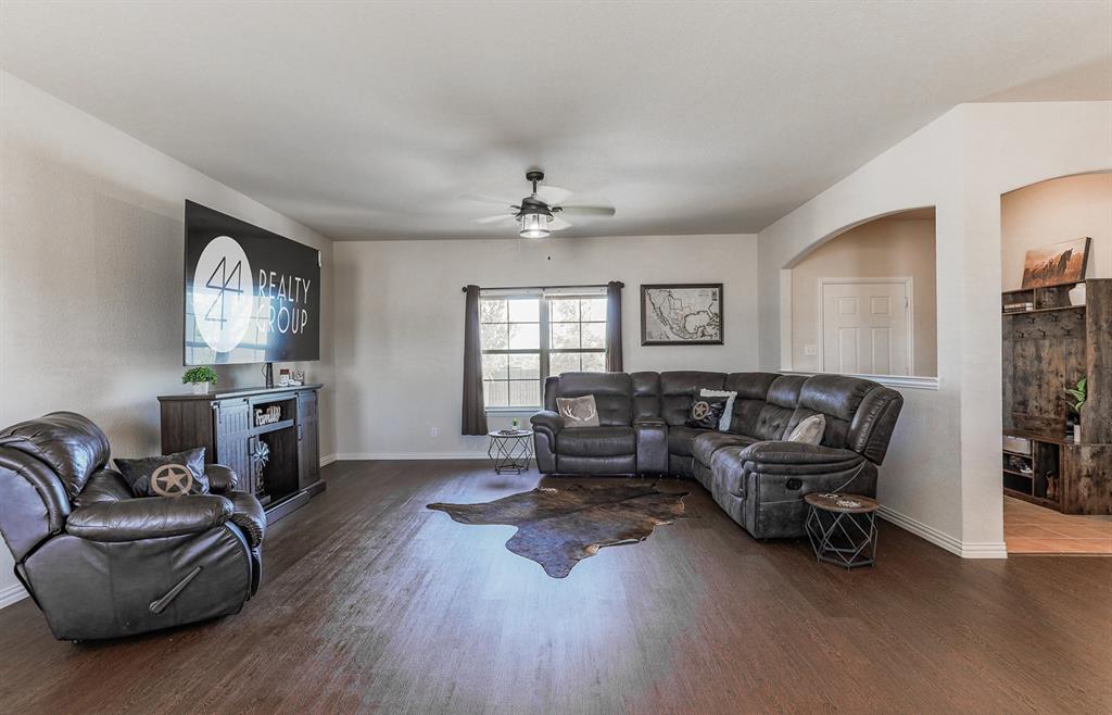 120 Hillcrest Lane Decatur, TX 76234 - Photo 14 of 33 a living room with furniture and a wooden floor