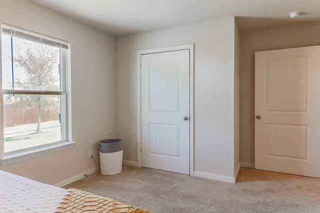 a living room with a couch and a window