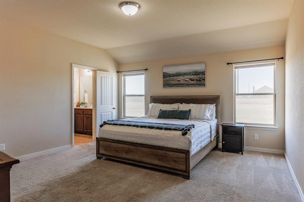 120 Hillcrest Lane Decatur, TX 76234 - Photo 22 of 33 a spacious bedroom with a bed and window