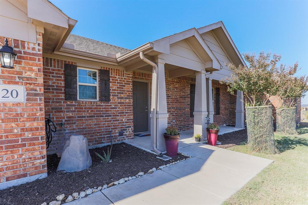 120 Hillcrest Lane Decatur, TX 76234 - Photo 4 of 33 a front view of a house with garden