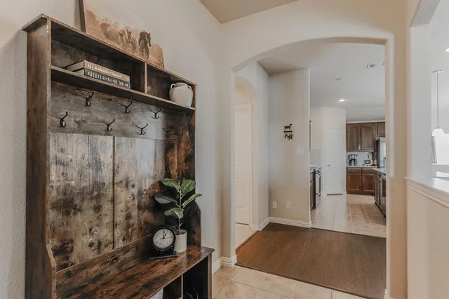 a view of hallway with wooden floor