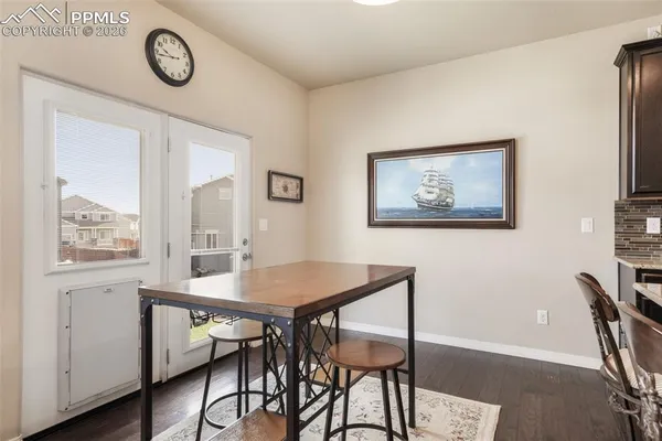 a view of a dining room with furniture wooden floor and a table