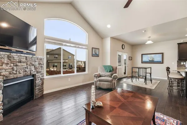 a living room with fireplace furniture and a flat screen tv