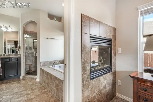 a view of kitchen with livingroom and wooden floor
