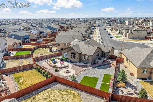 an aerial view of residential houses with outdoor space