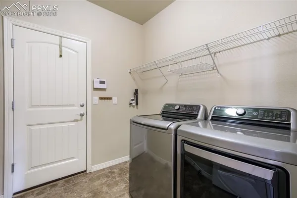 a view of storage and utility room with washer and dryer