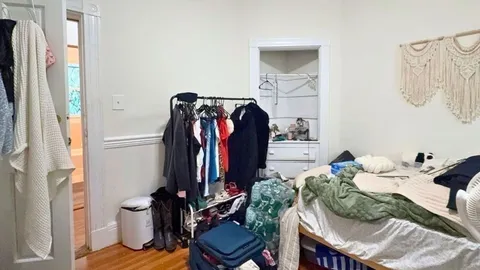 a bed room with furniture and a wooden floor