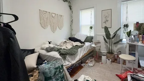 a view of walk in closet with clothes