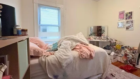 a en suite bathroom with a granite countertop sink and a mirror