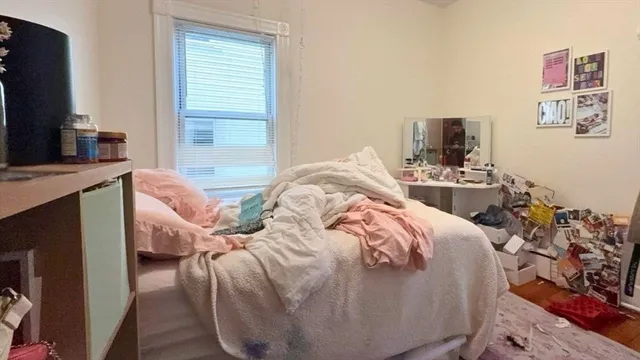 a en suite bathroom with a granite countertop sink and a mirror