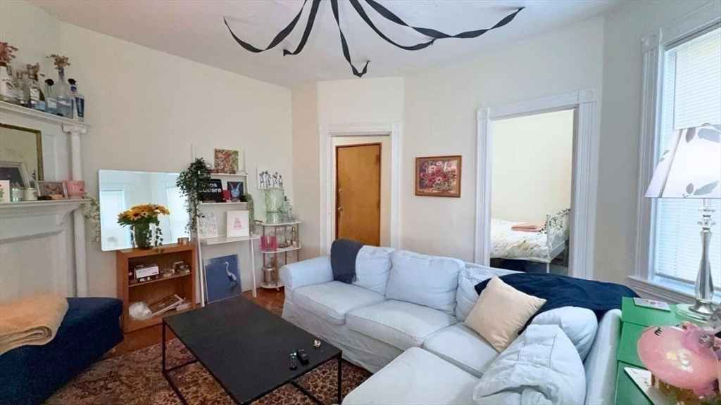 26 Darling Street, Unit 2 Boston, MA 02120 - Photo 2 of 25 a living room with furniture and a window