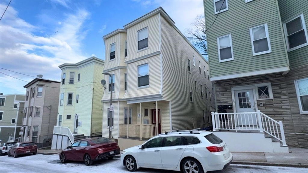 26 Darling Street, Unit 2 Boston, MA 02120 - Photo 24 of 25 a car parked in front of a brick building