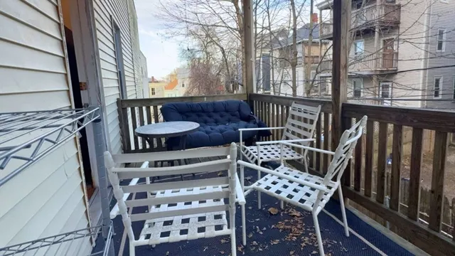 a view of a chairs and table on the deck