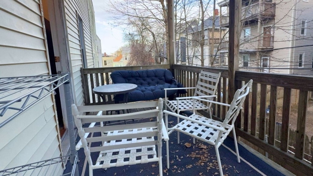26 Darling Street, Unit 2 Boston, MA 02120 - Photo 3 of 25 a view of a chairs and table on the deck