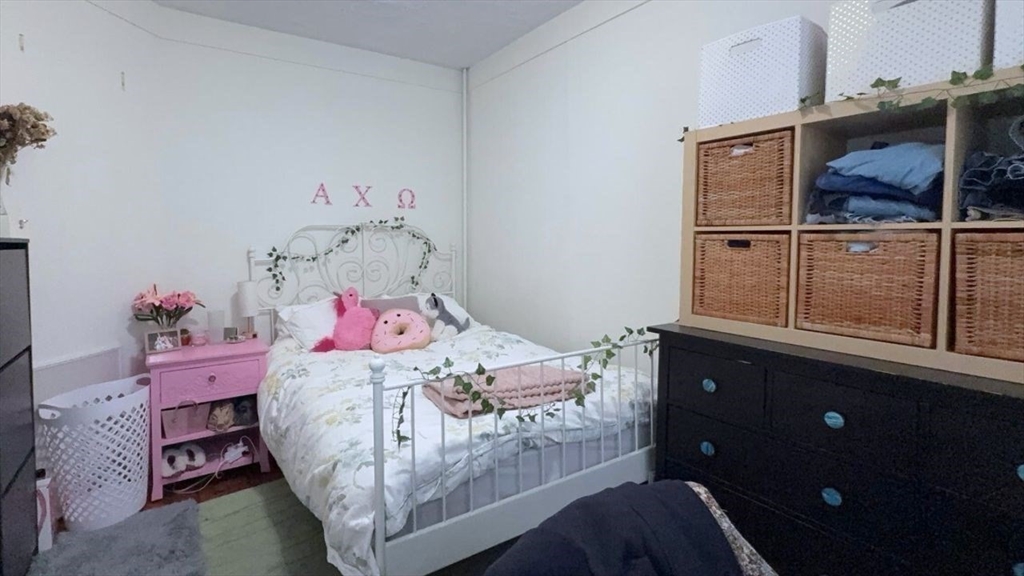 26 Darling Street, Unit 2 Boston, MA 02120 - Photo 9 of 25 a bedroom with a bed and wooden floor