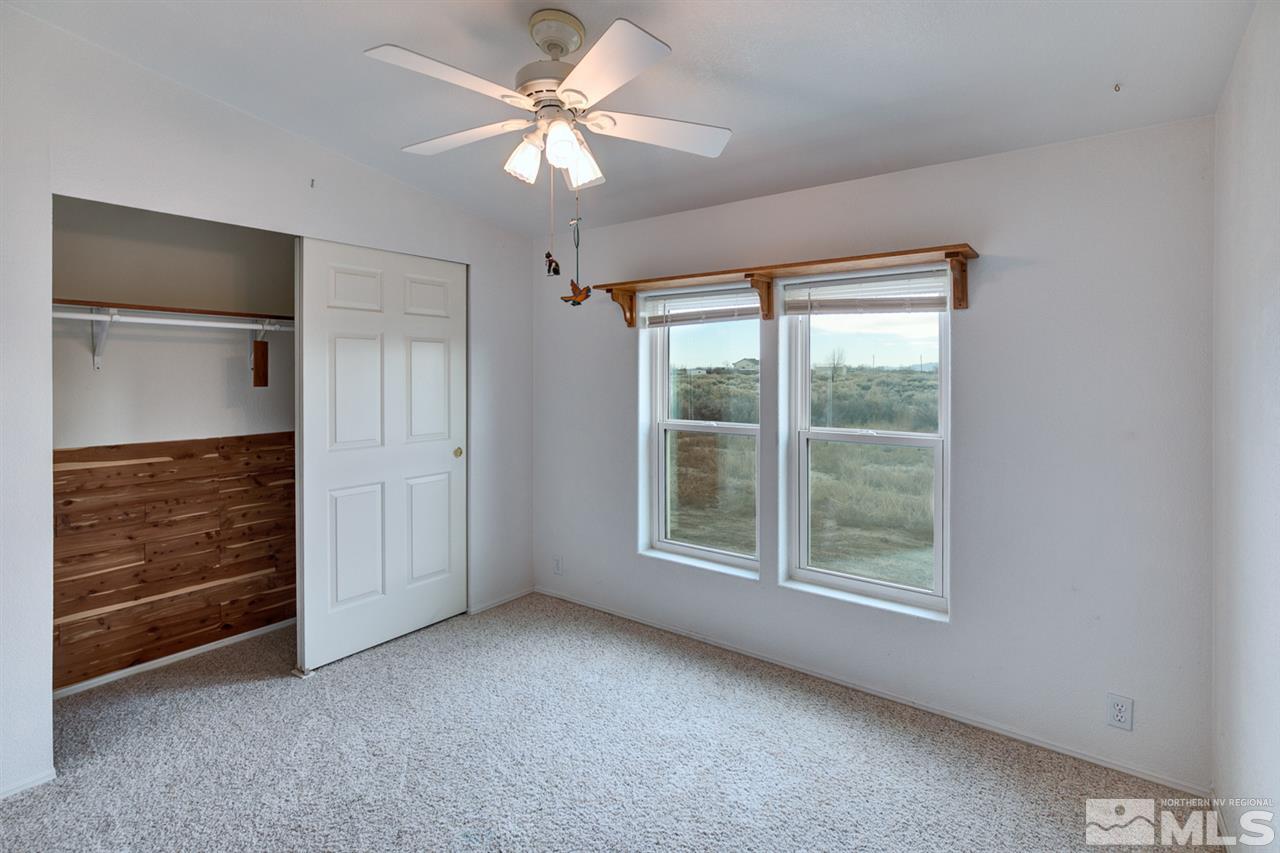 5396 Cody Road Fallon, NV 89406 - Photo 12 of 24 an empty room with fan and windows