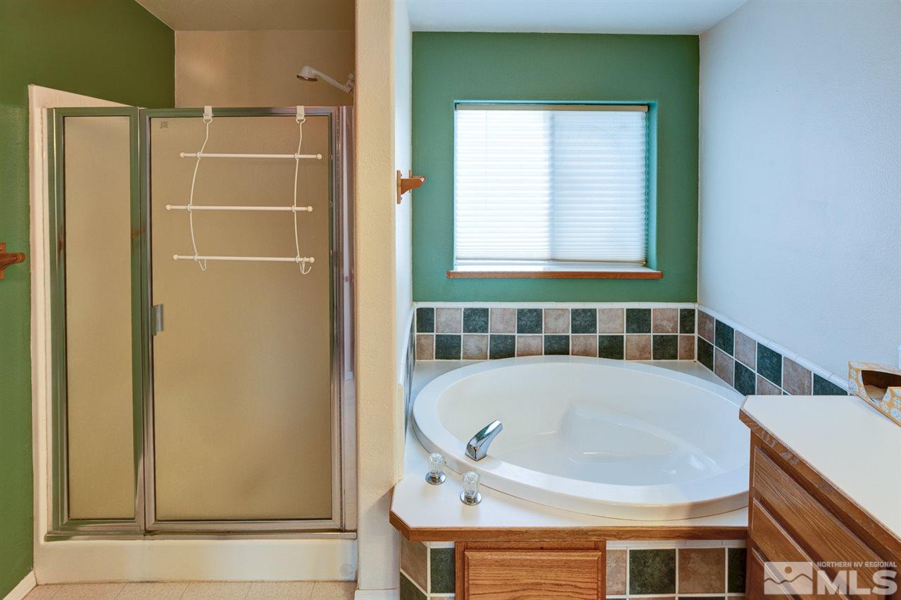 5396 Cody Road Fallon, NV 89406 - Photo 18 of 24 a bathroom with a tub and shower
