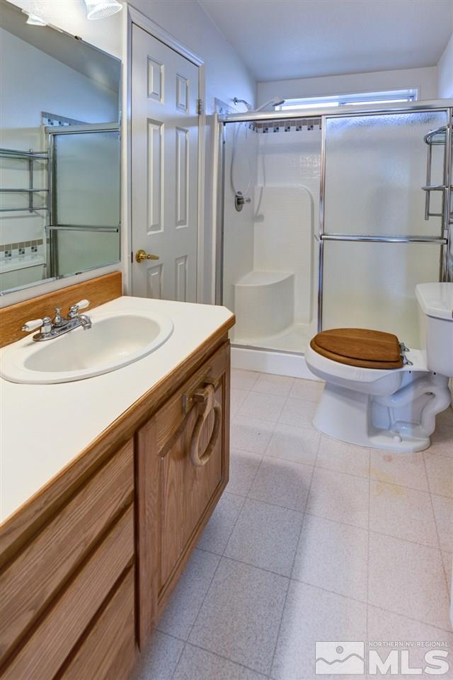 5396 Cody Road Fallon, NV 89406 - Photo 10 of 24 a bathroom with a sink a toilet and shower