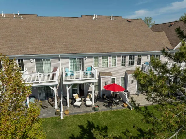 an aerial view of a house with a lake view