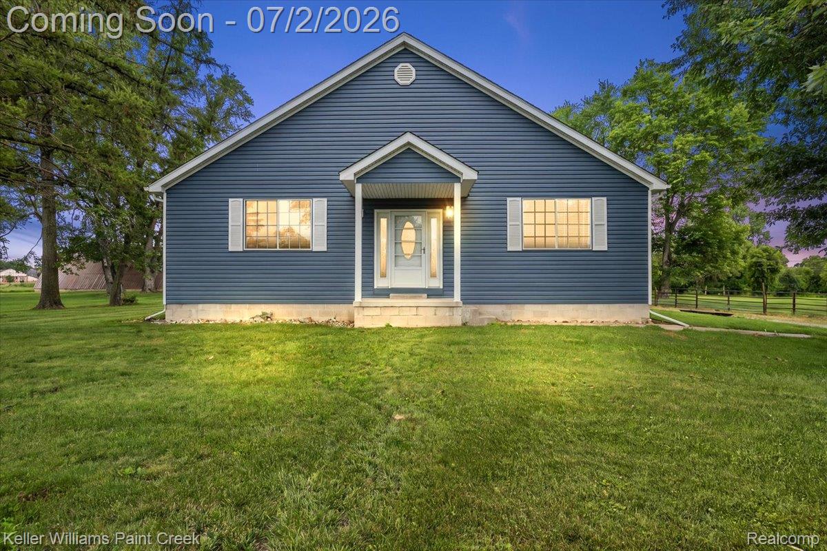 Blue siding exterior with white trim and shutters