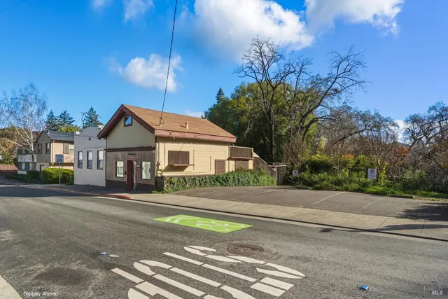 an empty room with closet and windows
