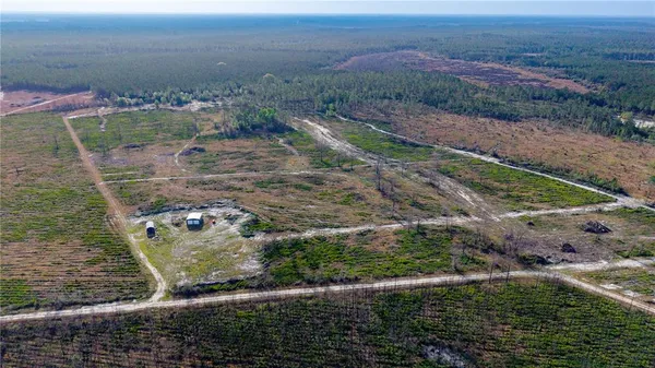 a view of a yard with an outdoor seating
