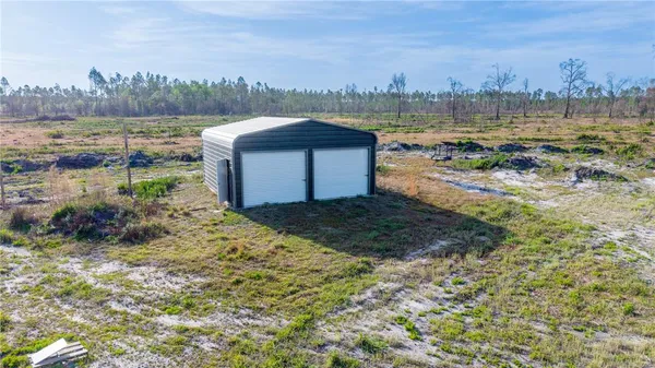 a view of a field with an ocean