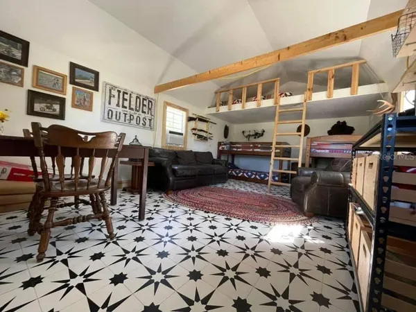 a view of a livingroom with furniture and furniture