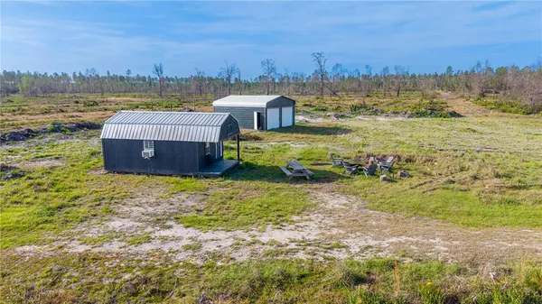 a view of a backyard with plants