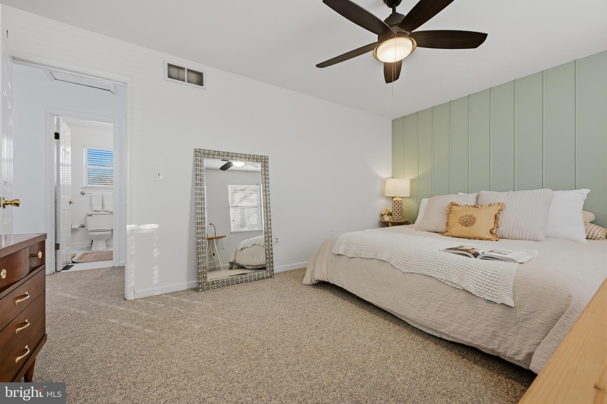 1707 Millstone Drive Edgewater, MD 21037 - Photo 17 of 39 a spacious bedroom with a bed and ceiling fan