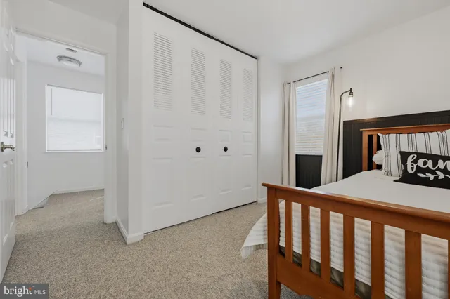 a bedroom with a bed and a table