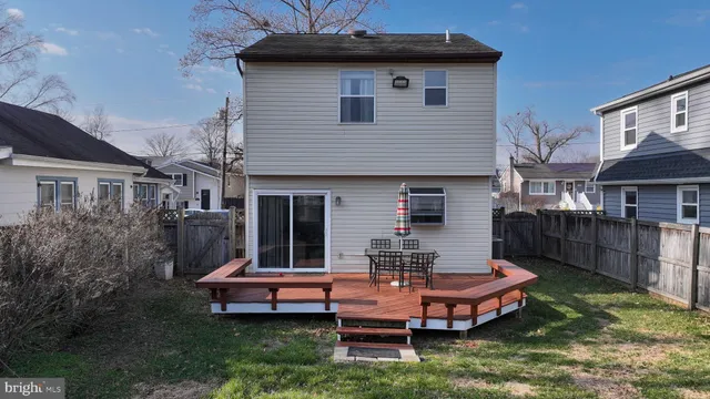 a front view of house with a garden