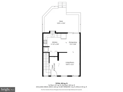 a picture of a bench in front of a wall